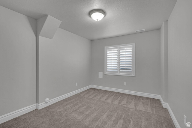 5575 S 1350 E, South Ogden, UT 84403 - carpeted spare room featuring a textured ceiling and baseboards