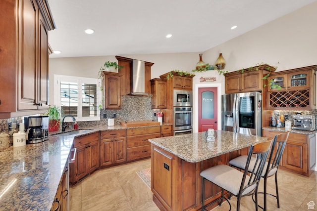 4390 N Diamond Ln, Erda, UT 84074 - kitchen featuring stainless steel appliances, wall chimney range hood, vaulted ceiling, decorative backsplash, and a kitchen island