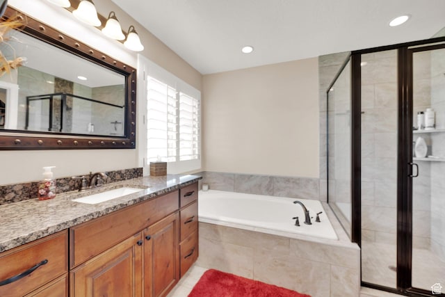 4390 N Diamond Ln, Erda, UT 84074 - bathroom featuring vanity, a stall shower, a bath, and recessed lighting