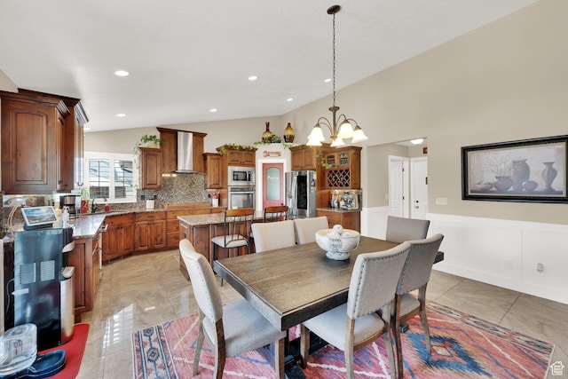 4390 N Diamond Ln, Erda, UT 84074 - dining space with lofted ceiling, a chandelier, a wainscoted wall, and recessed lighting