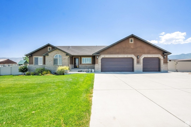 4390 N Diamond Ln, Erda, UT 84074 - single story home with a garage, concrete driveway, and brick siding