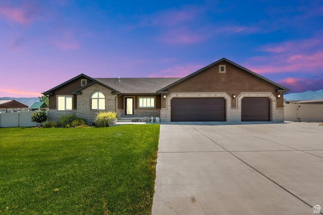 4390 N Diamond Ln, Erda, UT 84074 - ranch-style home with a garage, concrete driveway, and brick siding