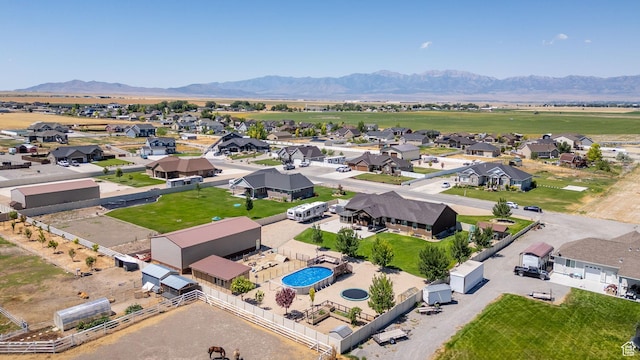4390 N Diamond Ln, Erda, UT 84074 - aerial perspective of suburban area featuring a pool and a mountain backdrop