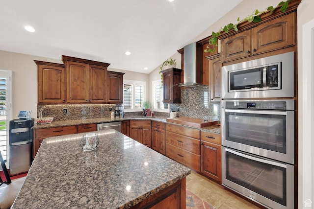 4390 N Diamond Ln, Erda, UT 84074 - kitchen featuring stainless steel appliances, wall chimney exhaust hood, tasteful backsplash, dark stone countertops, and lofted ceiling