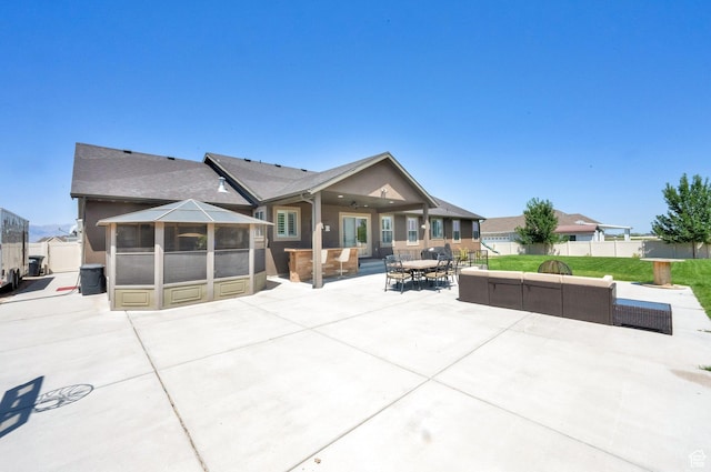 4390 N Diamond Ln, Erda, UT 84074 - back of property featuring a patio, a hot tub, outdoor lounge area, and outdoor dining space