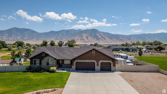 4390 N Diamond Ln, Erda, UT 84074 - ranch-style house with a garage, driveway, a gate, and a mountain view