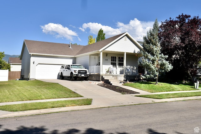 1568 Dawson Ln, Tooele, UT 84074 - ranch-style house with an attached garage, a porch, concrete driveway, and a front yard