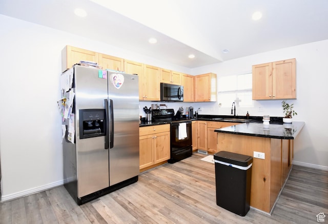 1568 Dawson Ln, Tooele, UT 84074 - kitchen with black appliances, light brown cabinets, a peninsula, dark countertops, and recessed lighting