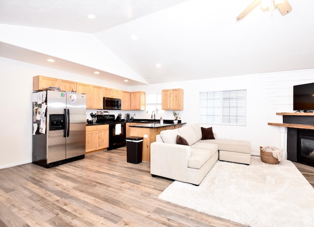 1568 Dawson Ln, Tooele, UT 84074 - living area featuring lofted ceiling, light wood-style flooring, a glass covered fireplace, recessed lighting, and a ceiling fan