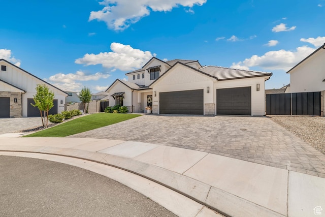 2950 E Naboo Ln, St George, UT 84790 - modern farmhouse style home with decorative driveway, a garage, stone siding, and a tile roof