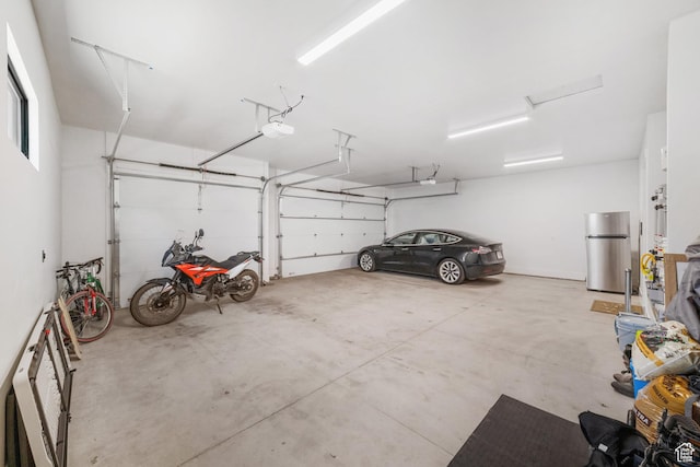 2950 E Naboo Ln, St George, UT 84790 - garage with freestanding refrigerator and a garage door opener