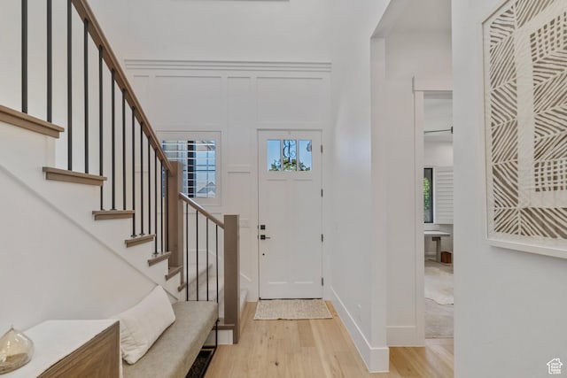 2950 E Naboo Ln, St George, UT 84790 - entryway featuring light wood-style floors, stairs, and a decorative wall