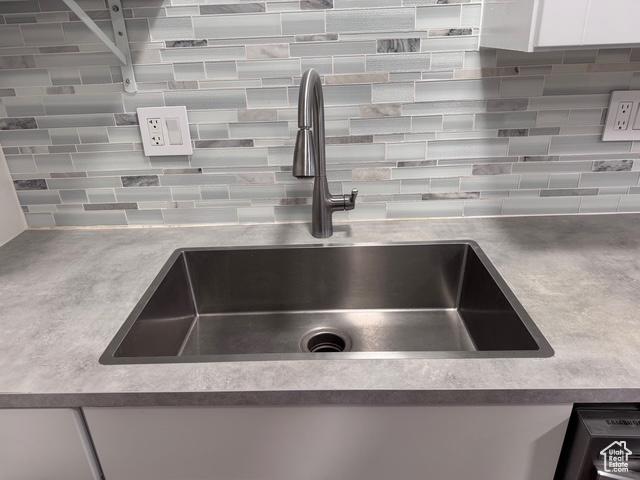 54 W 300 S, Orem, UT 84058 - kitchen view of tasteful backsplash, white cabinetry, and light countertops