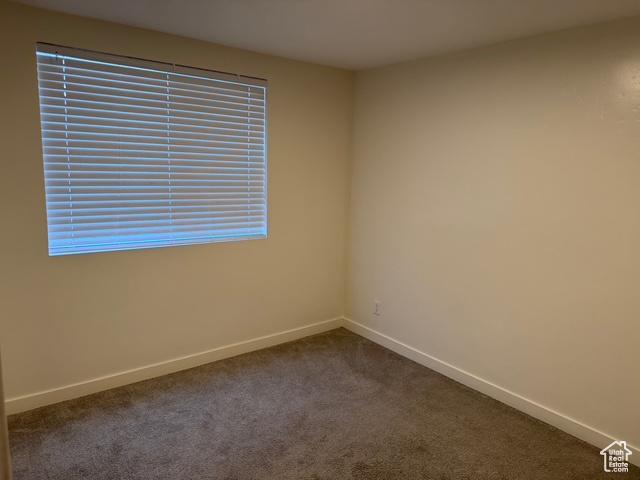 54 W 300 S, Orem, UT 84058 - empty room with baseboards and dark carpet