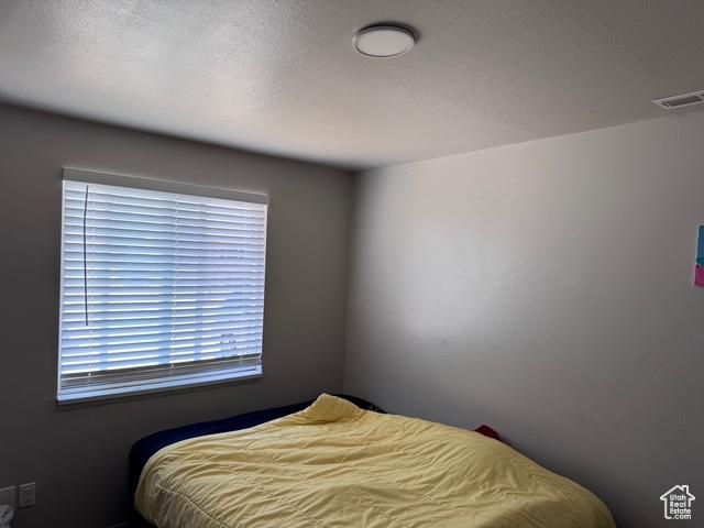 54 W 300 S, Orem, UT 84058 - bedroom with a textured ceiling