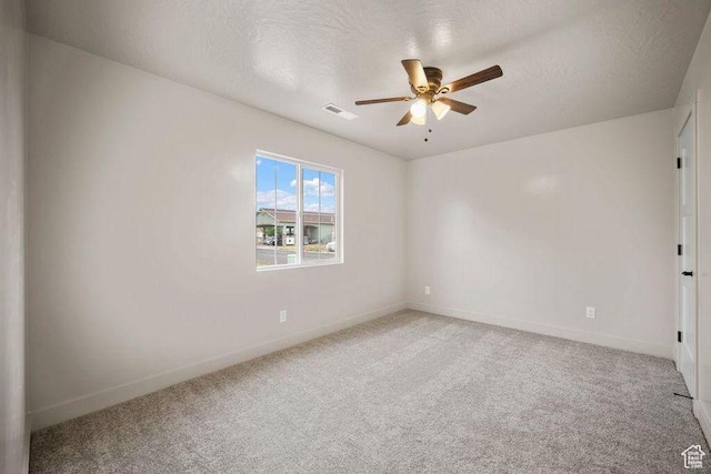 775 E 100 N Unit 83, Enterprise, UT 84725 - unfurnished room featuring a ceiling fan, light colored carpet, and a textured ceiling