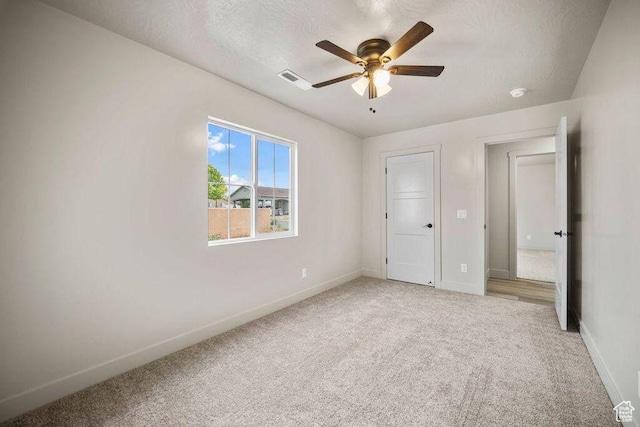 775 E 100 N Unit 83, Enterprise, UT 84725 - unfurnished bedroom featuring light carpet and a ceiling fan
