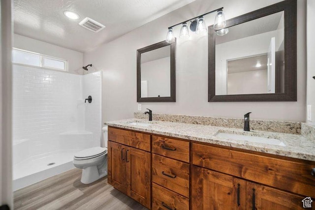 775 E 100 N Unit 83, Enterprise, UT 84725 - full bathroom with wood finished floors, a shower, and double vanity
