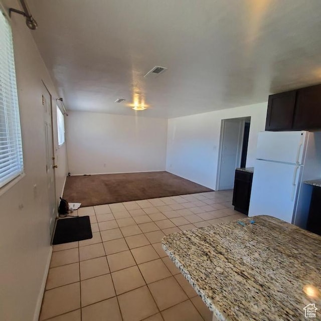 275 N 100 W Unit 1-6, Spanish Fork, UT 84660 - kitchen with freestanding refrigerator, light colored carpet, and light tile patterned floors