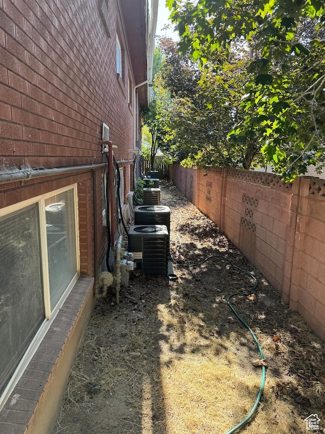 275 N 100 W Unit 1-6, Spanish Fork, UT 84660 - view of property exterior with a fenced backyard and brick siding