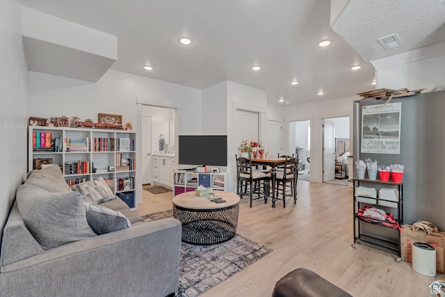 1058 W 570 N, Orem, UT 84057 - living room with light wood-style floors and recessed lighting