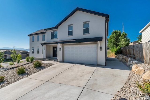 1058 W 570 N, Orem, UT 84057 - view of front facade with stucco siding, a garage, and driveway