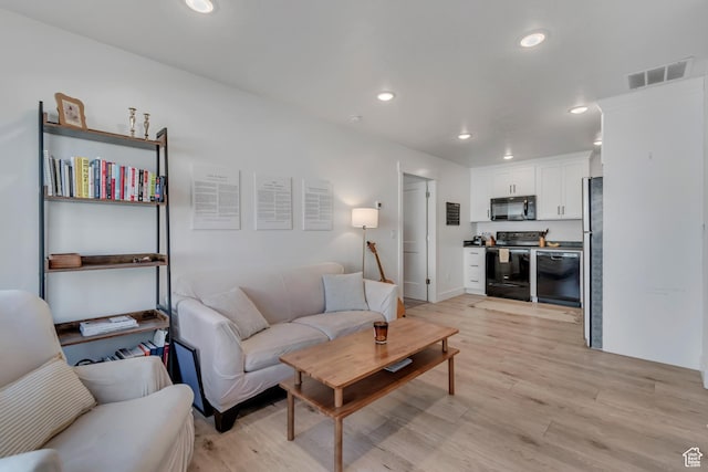 1058 W 570 N, Orem, UT 84057 - living area featuring light wood-style flooring and recessed lighting