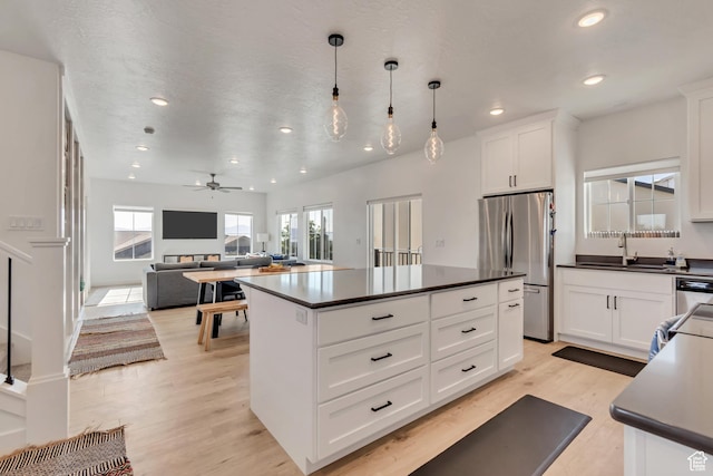 1058 W 570 N, Orem, UT 84057 - kitchen with appliances with stainless steel finishes, dark countertops, healthy amount of natural light, and recessed lighting
