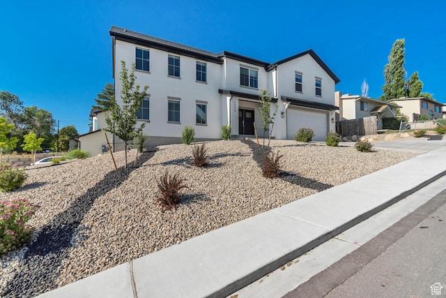 1058 W 570 N, Orem, UT 84057 - view of front of home featuring an attached garage, driveway, and stucco siding