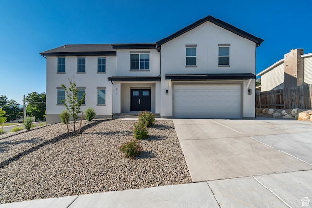 1058 W 570 N, Orem, UT 84057 - view of front facade featuring stucco siding, an attached garage, and concrete driveway