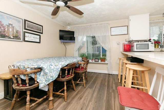 14360 N 6000 W, Garland, UT 84312 - dining room with wood finished floors, ceiling fan, and ornamental molding