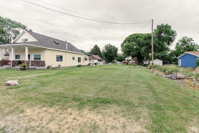 14360 N 6000 W, Garland, UT 84312 - view of green lawn featuring a porch