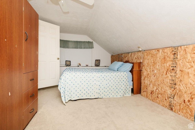 14360 N 6000 W, Garland, UT 84312 - carpeted bedroom featuring lofted ceiling, a ceiling fan, and a textured ceiling