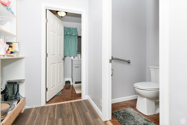 14360 N 6000 W, Garland, UT 84312 - bathroom featuring toilet and wood finished floors