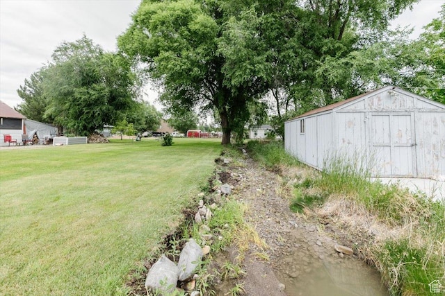 14360 N 6000 W, Garland, UT 84312 - view of green lawn featuring a shed