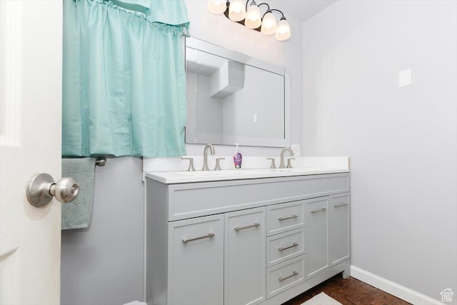 14360 N 6000 W, Garland, UT 84312 - full bathroom with double vanity and baseboards