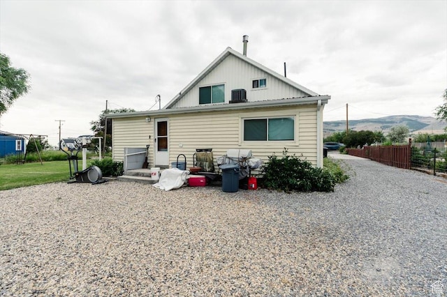 14360 N 6000 W, Garland, UT 84312 - rear view of property with board and batten siding