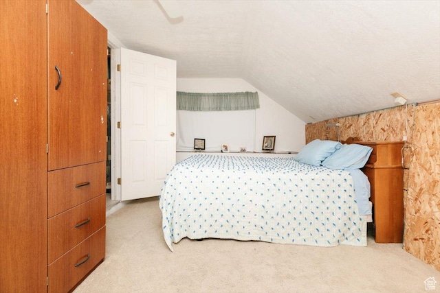 14360 N 6000 W, Garland, UT 84312 - bedroom with light colored carpet, vaulted ceiling, and ceiling fan