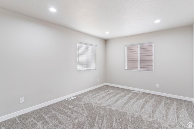 2835 Lincoln Ave, Ogden, UT 84401 - carpeted spare room with baseboards and recessed lighting