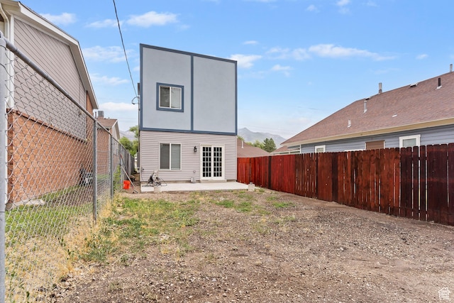 2835 Lincoln Ave, Ogden, UT 84401 - rear view of house with a patio area and a fenced backyard