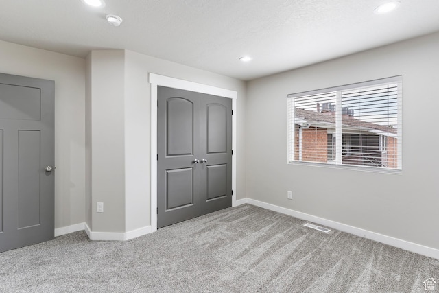 2835 Lincoln Ave, Ogden, UT 84401 - unfurnished bedroom with carpet floors, recessed lighting, and a closet