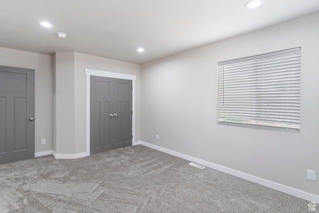 2835 Lincoln Ave, Ogden, UT 84401 - unfurnished bedroom with recessed lighting, carpet flooring, and a closet
