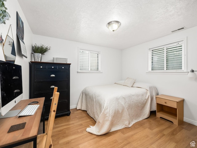 188 E 100 S, Santaquin, UT 84655 - bedroom with light wood-type flooring and a textured ceiling