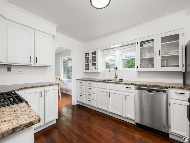 188 E 100 S, Santaquin, UT 84655 - kitchen with dishwasher, arched walkways, dark wood finished floors, glass insert cabinets, and white cabinetry