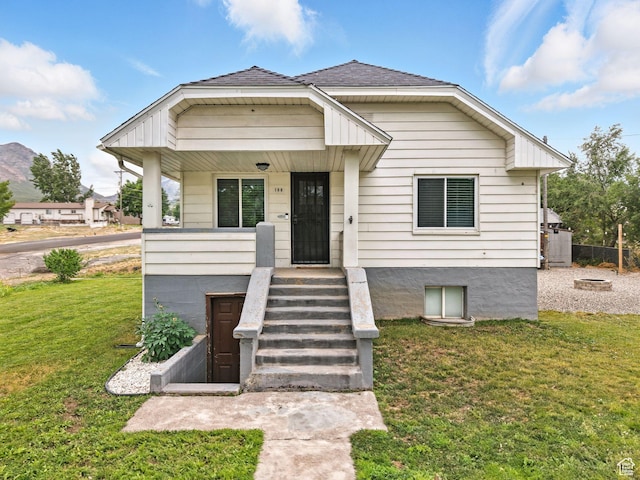 188 E 100 S, Santaquin, UT 84655 - view of front of house with a front yard, covered porch, and a shingled roof