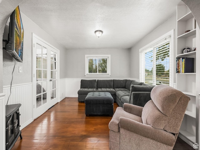 188 E 100 S, Santaquin, UT 84655 - living area featuring plenty of natural light, a textured ceiling, wainscoting, wood finished floors, and built in shelves