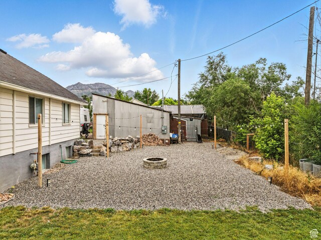 188 E 100 S, Santaquin, UT 84655 - view of yard featuring an outdoor fire pit and a storage shed