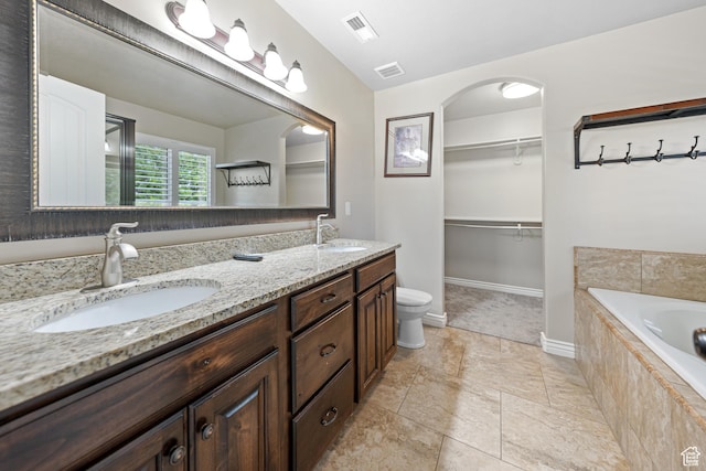 488 N 1375 E, Layton, UT 84040 - bathroom with double vanity, a bath, and a walk in closet