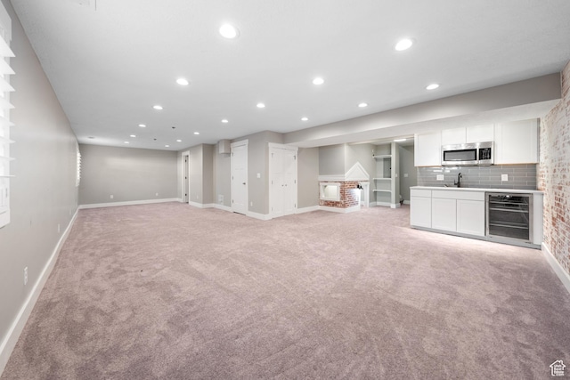 488 N 1375 E, Layton, UT 84040 - unfurnished living room featuring wine cooler, light colored carpet, and recessed lighting