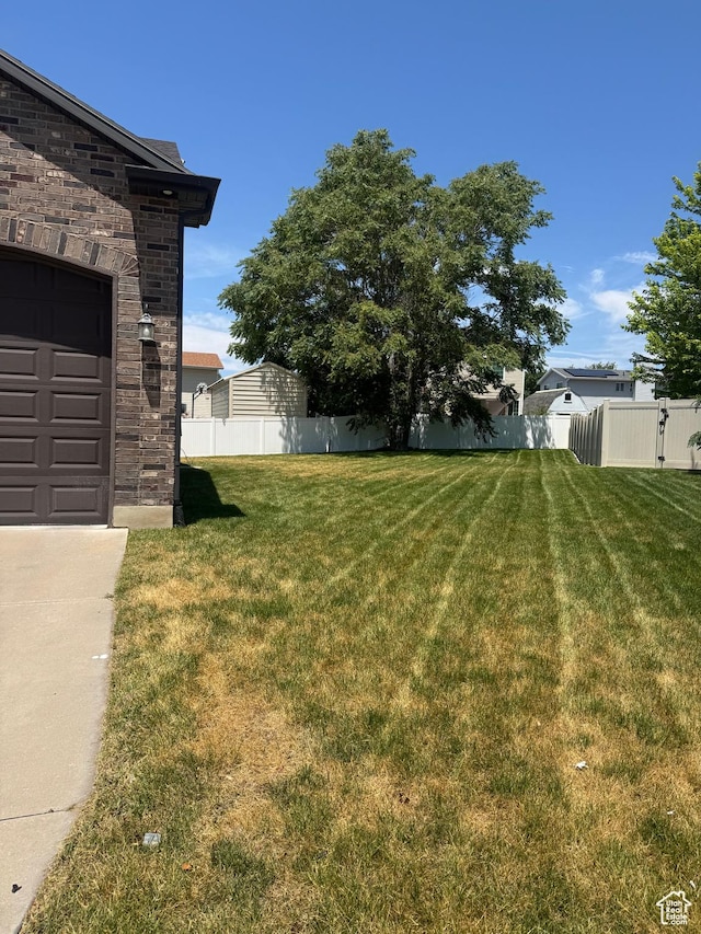 488 N 1375 E, Layton, UT 84040 - view of yard featuring a garage